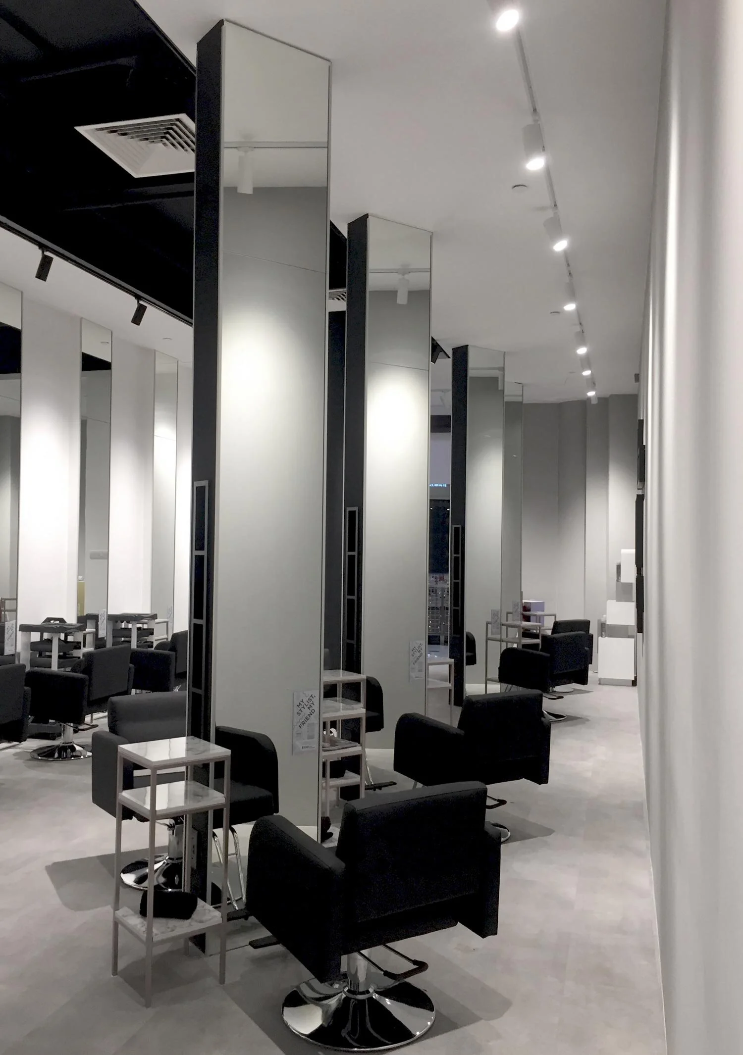 Our salon space can comfortably accommodate 15 clients at a time and everyone has their own mirror. This is the significance of our unique ceiling-high mirror. 