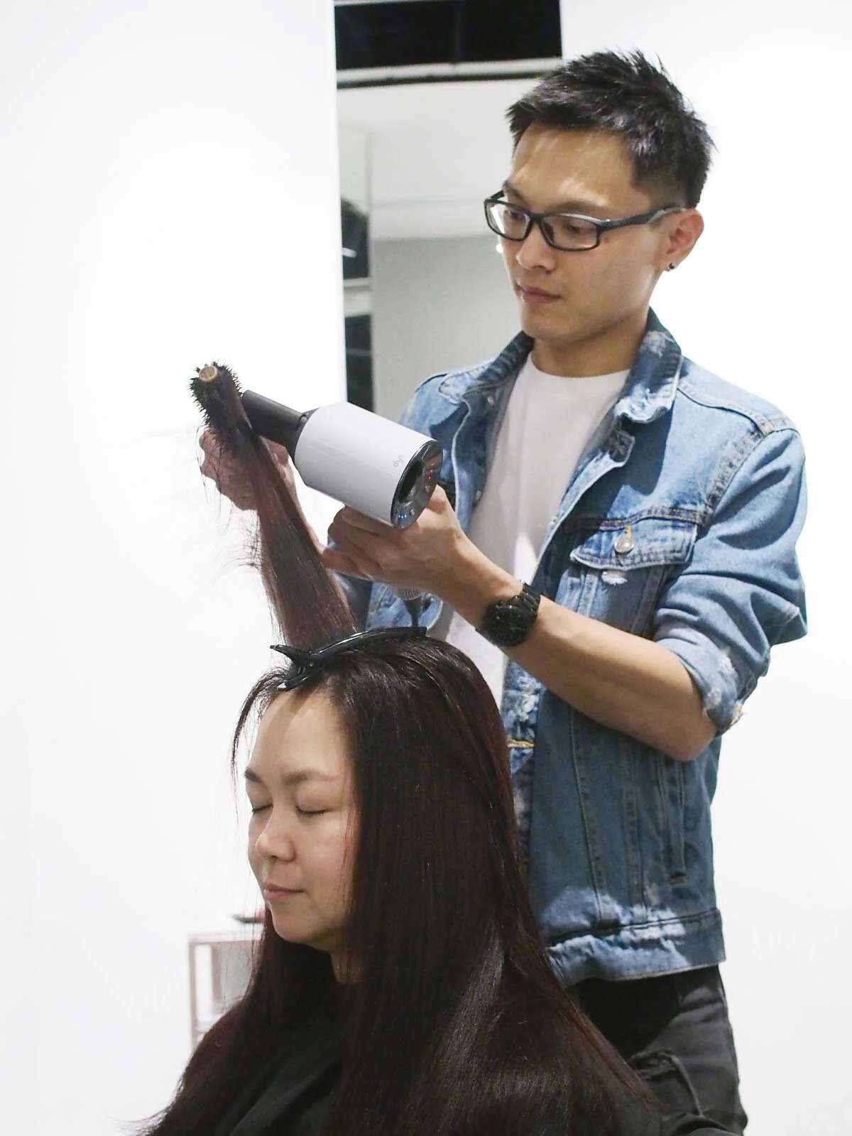 Creative Stylist, Darren Ooi, completing the Japanese Airy Hair Treatment with a blow dry