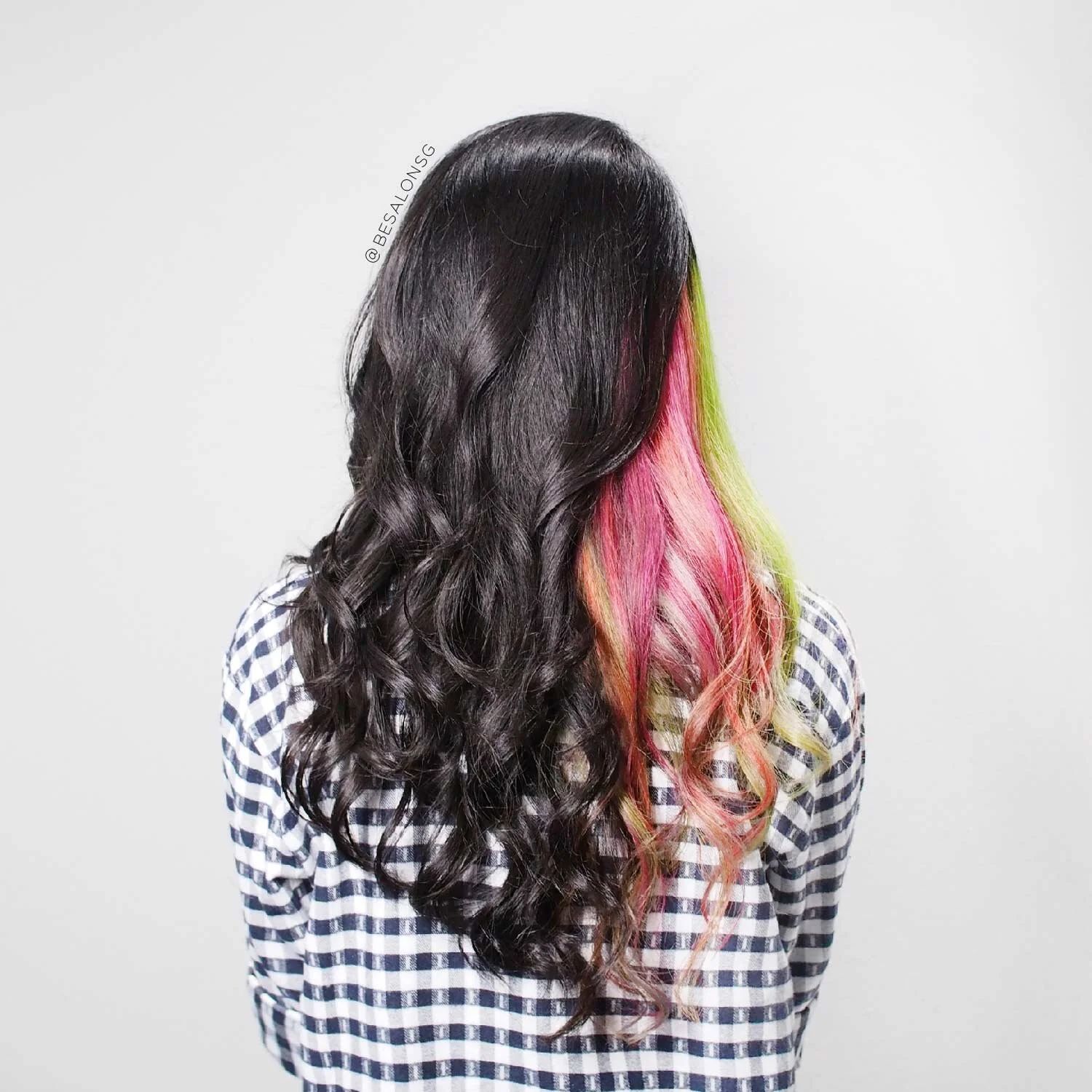 5. Bold and Edgy in Neon
A stunning colour combination strategically placed only on one side of your head to accentuate the better side of your face. As the neon colours are already bright and eye-catching, we love that it is done in such a way so that you will not look like a walking highlighter swatch. You can go for bold neon colours, but just a tip to let the colours take up less than half of your hair if you have long hair. The contrast gives it more edge.