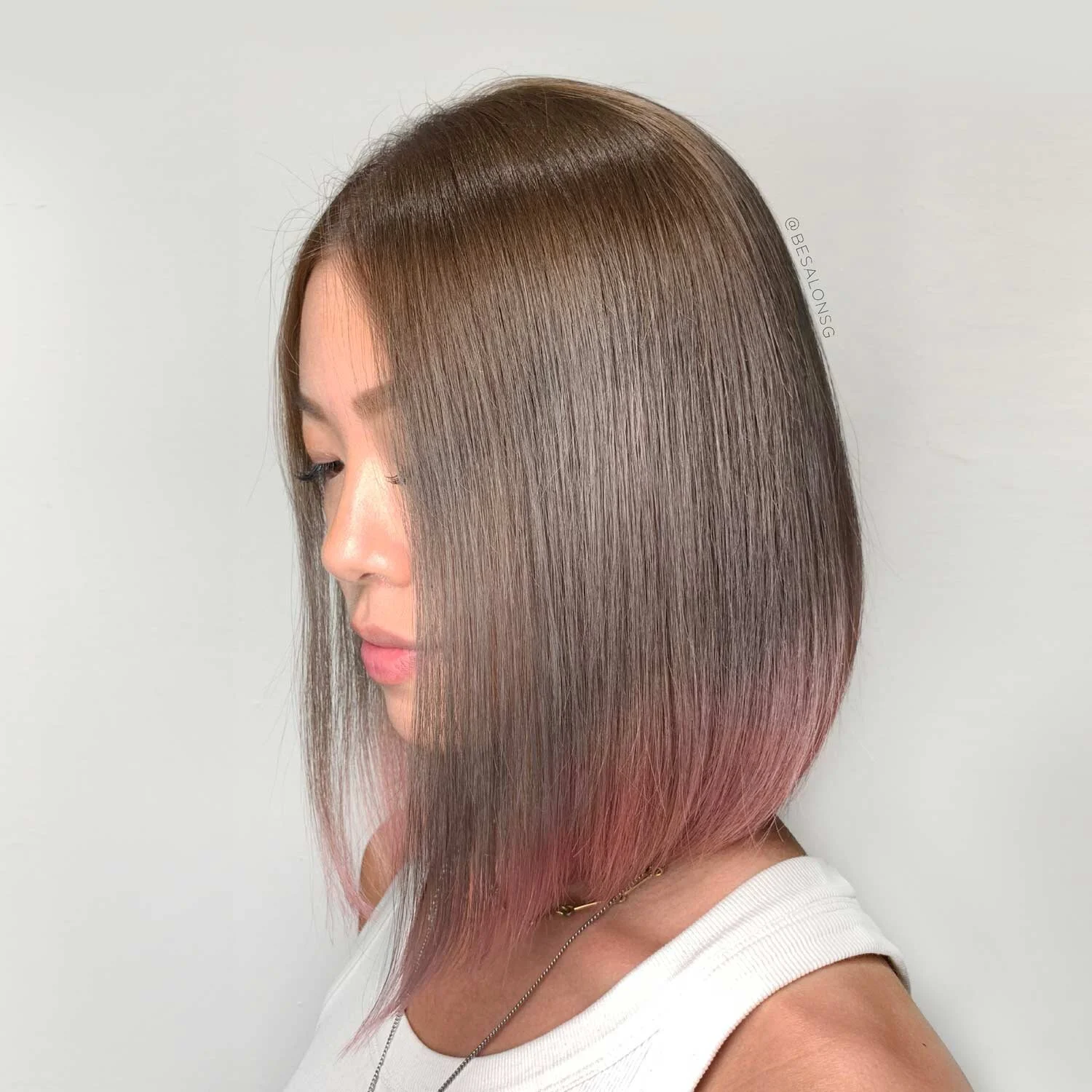 6. Dark Ash Brown with Pink Tips
Don't want a multicoloured hair the shouts "UNICORN"? This subtle dark ash brown and pink tips hair colour is the perfect design for you. We love the smooth gradation of colour done by our Creative Stylist, Darren Ooi. Other hair ends colours that goes well with dark ash brown shades are blue, turquoise, coral, and lilac.